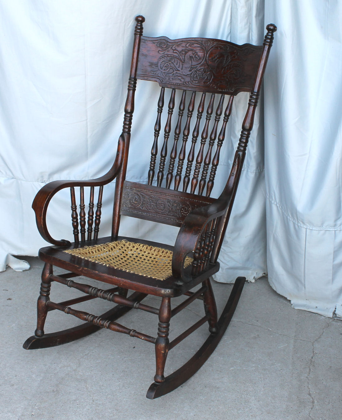 rocking chair with dragons in the back  bentwood arms